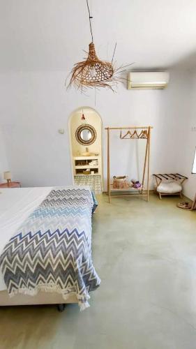 a bedroom with a bed and a mirror in it at Seamoon in Plataniás