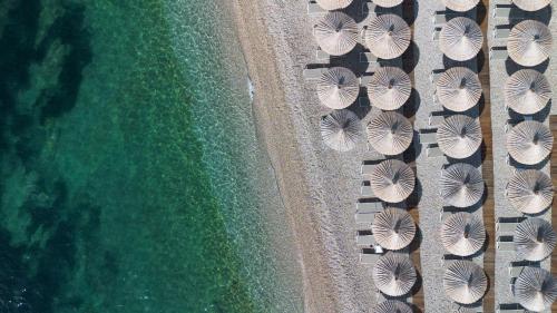 an overhead view of a beach with umbrellas and the ocean at Radisson Blu Resort & Spa in Split