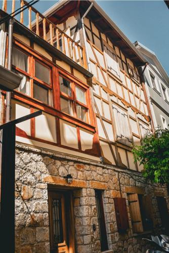 a building with many windows on the side of it at Wake-up-by-the-sea! in Nydri