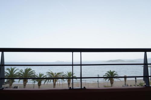 a view of the ocean from a hotel room at SEA LA VIE Apartments & Maisonette in Livanátai