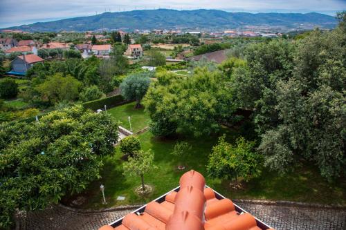 an aerial view of a garden with trees and houses at Recanto Transmontano in Macedo de Cavaleiros