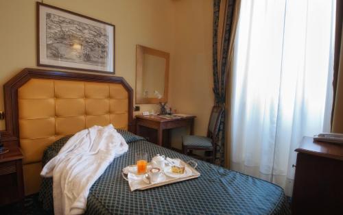 Letto o letti in una camera di Hotel San Giorgio