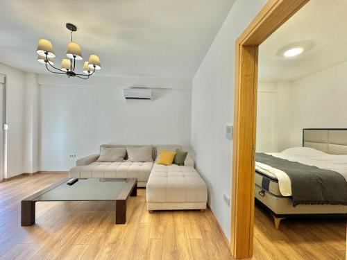 a living room with a couch and a bed at One bedroom Apartment 777 in Budva