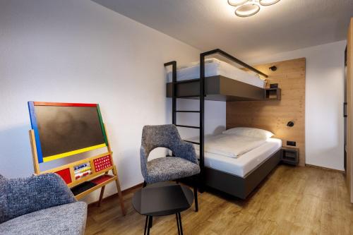 Ένα ή περισσότερα κρεβάτια σε δωμάτιο στο Ferienwohnung TURNA Malbun