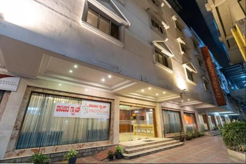 a store front of a building with a sign on it at Sree Parijatha Grand in Bengaluru