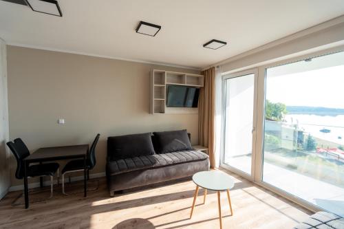 Posezení v ubytování OW Mewa domki apartamenty nad jeziorem
