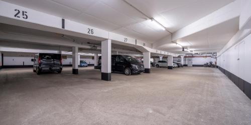 a large parking garage with cars parked in it at Best Western Hotel Schmoeker-Hof in Norderstedt