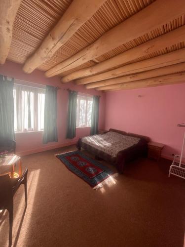 Postel nebo postele na pokoji v ubytování Trinity Home Stay