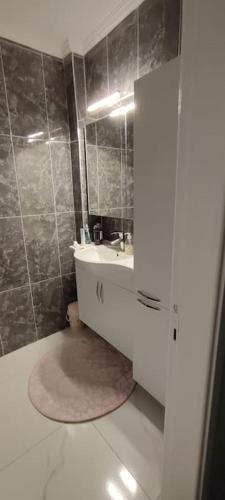 a bathroom with a sink and a mirror at Modern design house in the heart of Marmaris in Marmaris