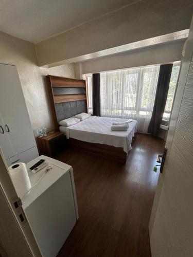Postel nebo postele na pokoji v ubytování theblue suıt otel cafe restaurant