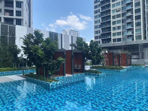 a large swimming pool in a city with tall buildings at Platinum Arena Old Klang Road Midvalley in Kuala Lumpur