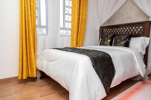 Katil atau katil-katil dalam bilik di CynRose Suites