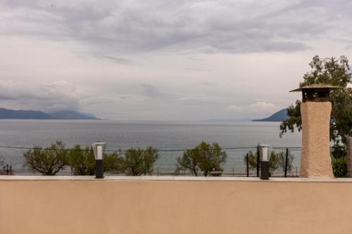 a wall with a view of the water at Sea side in Pteleós