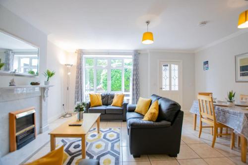 a living room with a couch and a table at 17 - Spacious 2 Bed Apt with Parking in Galway