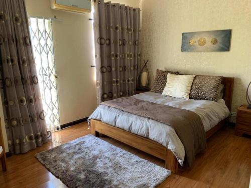 Katil atau katil-katil dalam bilik di Villa Beach Lane