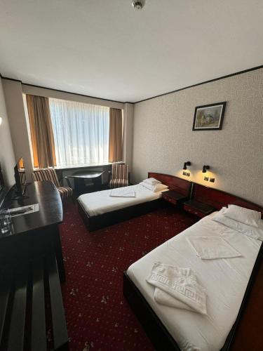 Katil atau katil-katil dalam bilik di Hotel Aurora