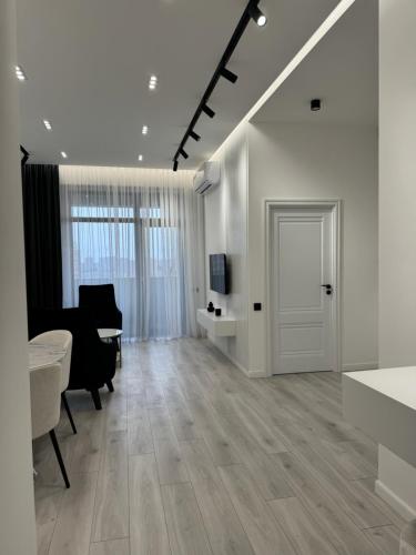 TV a/nebo společenská místnost v ubytování White New Appartment