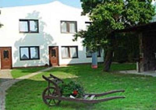 a bike sitting in the grass in front of a house at Haus Dornröschen in Koserow
