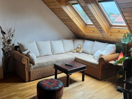 a living room with a couch and a table at Dům Stašov in Stašov