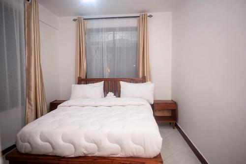 Postel nebo postele na pokoji v ubytování Domin Apartments