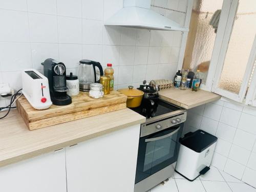 a kitchen with a counter top with a stove top oven at Monaco Cote d Azur in Beausoleil
