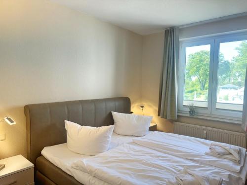 Postel nebo postele na pokoji v ubytování Villa Seeblick - Ferienwohnung 407