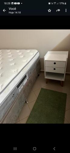 a bedroom with a bed and a nightstand and a bed sidx sidx at Eldorado Flat Service apto 601- BL 1 in Caldas Novas