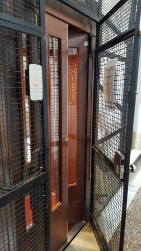 a pair of doors in a prison cell at Windows on Rome in Rome