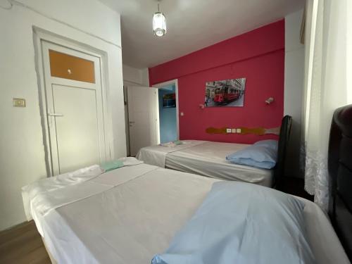Ένα ή περισσότερα κρεβάτια σε δωμάτιο στο Uygar Motel