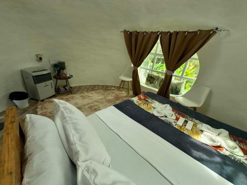 Кровать или кровати в номере Mt Matutum Domesville Glamping