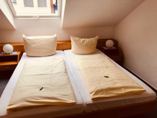 Postel nebo postele na pokoji v ubytování Haus am Meer, Hotel Garni