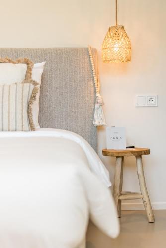 a bedroom with a bed and a side table at Boutiquehotel Omnia in Valkenburg