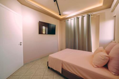 Postel nebo postele na pokoji v ubytování Ananda Apartments