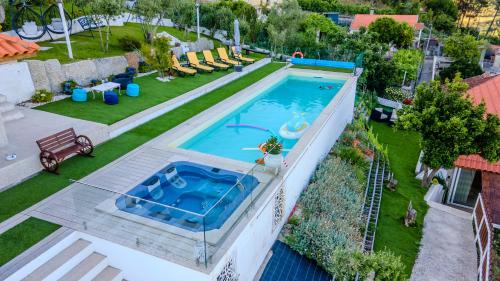 an overhead view of a swimming pool in a backyard at Quinta Baião, Douro Valley in Santa Cruz do Douro