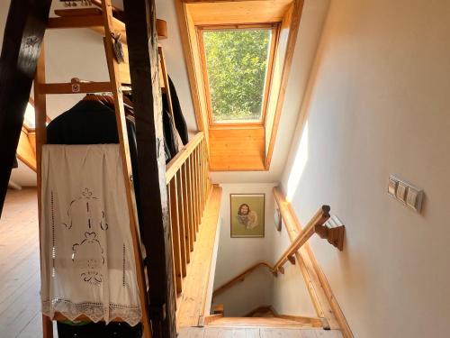 an overhead view of a room with a staircase and a window at Viljandi kesklinna majake ja kodune minispa in Viljandi