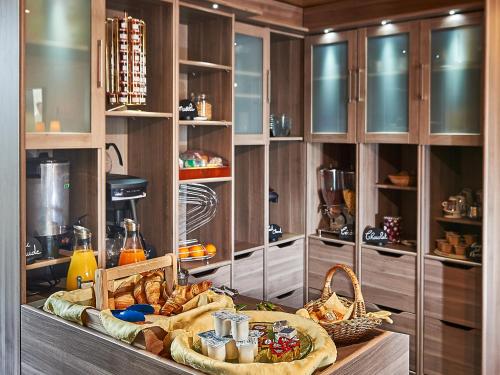 a kitchen with a buffet of food on a table at Au Relais Nivernais in Nevers