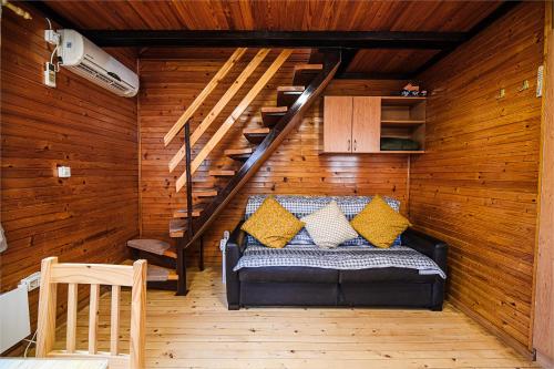 a room with a bed in a wooden wall at Holiday Home Brina 69 in Čatež ob Savi