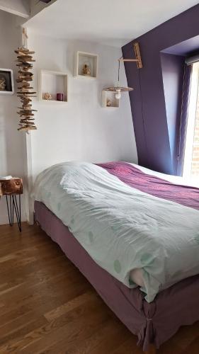 Ένα ή περισσότερα κρεβάτια σε δωμάτιο στο Charmant appartement avec vue face mer imprenable