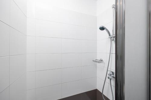 a bathroom with a shower with a glass door at Villa Tsampikos in Lachania