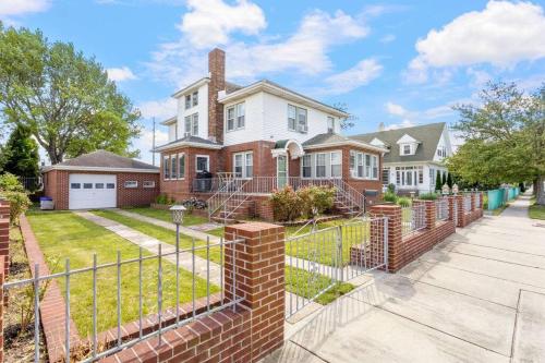 a brick fence in front of a house at AC 6BR 2BA Quiet Retreat Central Location in Atlantic City