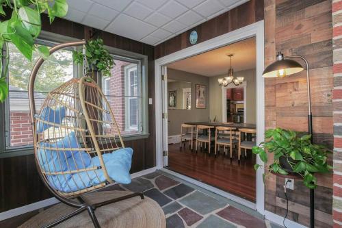 a room with a rocking chair and a dining room at AC 6BR 2BA Quiet Retreat Central Location in Atlantic City