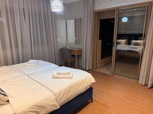 Postel nebo postele na pokoji v ubytování Luxuswohnung in Residence Coralia les orangers