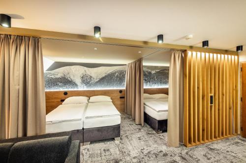 Postel nebo postele na pokoji v ubytování Harmony Hotel