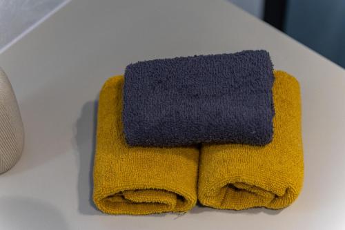 a pair of towels sitting on a table at Vila Aris in Kostrena