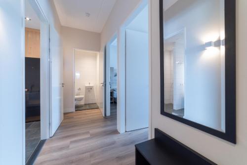 a large mirror on the wall of a room at Raadhuis Parc Ganuenta in Colijnsplaat