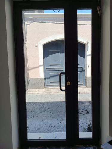 a view of a door through a window at Cuore di Aci - Casa degli Zelanti in Acireale