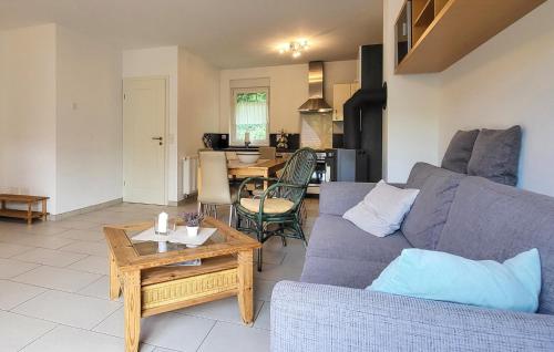 a living room with a couch and a table at Lovely Home In Zermützel With Sauna in Zermützel