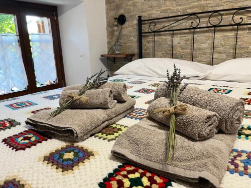 Letto o letti in una camera di Baita delle Rocche