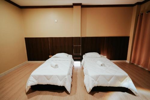 Ένα ή περισσότερα κρεβάτια σε δωμάτιο στο Tanjong Subang Jaya