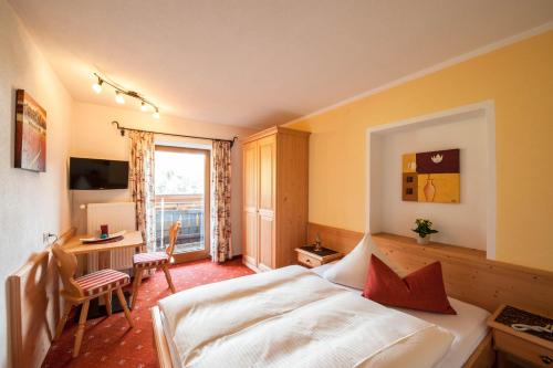 Postel nebo postele na pokoji v ubytování Gästehaus Wöberlerhof